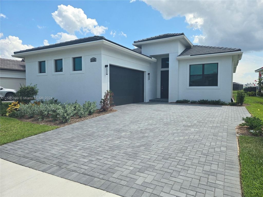 Photo of 11356 SW Pietra Way, Port Saint Lucie, FL 34987 (MLS # A11591399)