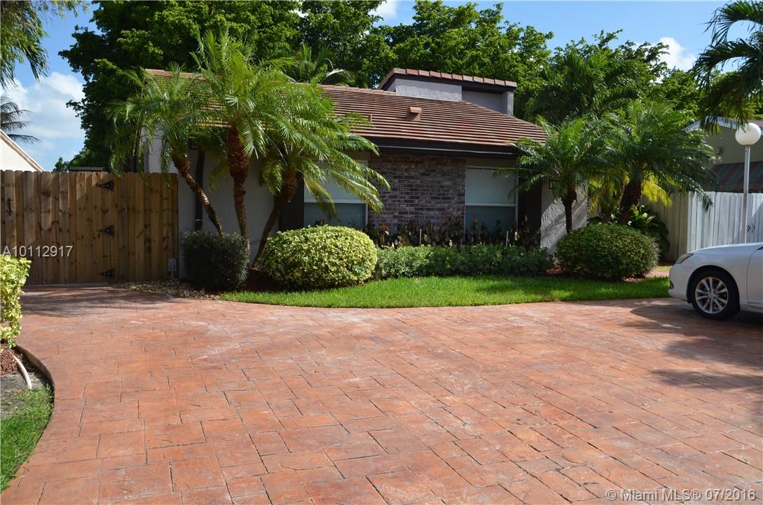 GREAT CONDITION LIKE NEW! COMPLETELY UPDATED 4/3 HOME NEAR FIU. NEW ROOF, NEW KITCHEN AND BATHS! IMPACT WINDOWS AND DOORS. PORCELAIN AND MARBLE FLOORS THROUGHOUT, 2 MASTER BEDROOMS AND 3 FULL BATHROOMS.