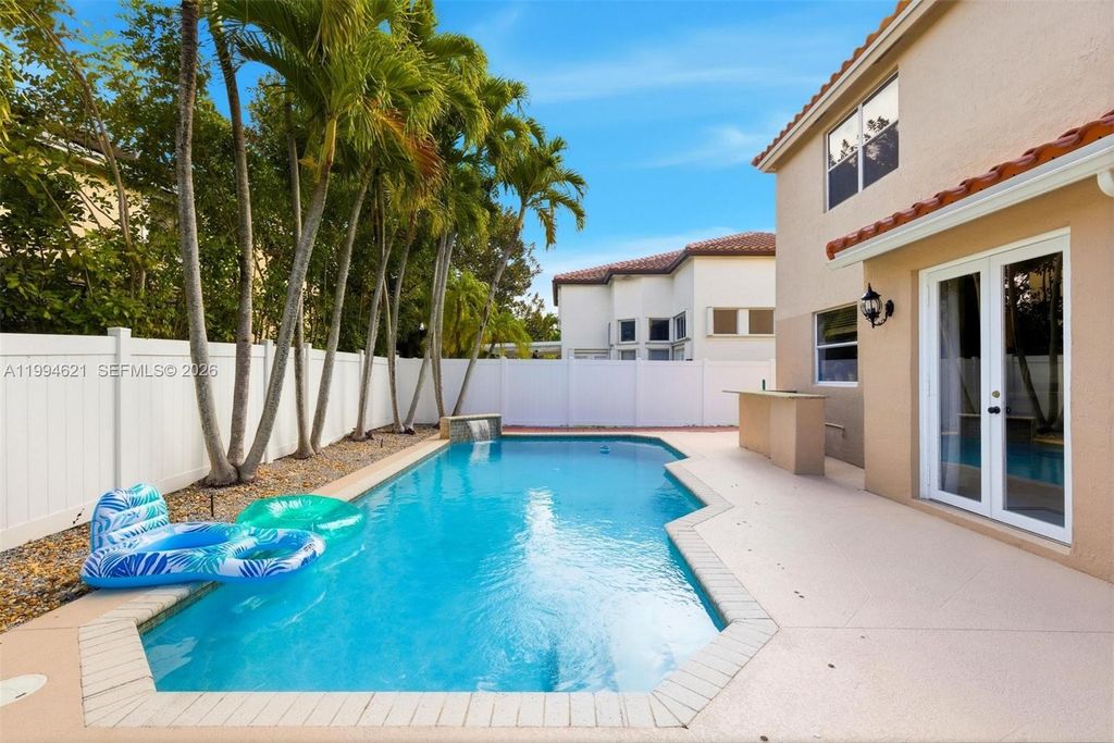 Photo of 5821 NW 62nd St, Parkland, FL 33067 (MLS # A11994621)