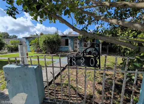 Photo of 820 Curtiss Dr, Opa Locka, FL 33054 (MLS # A12026560)
