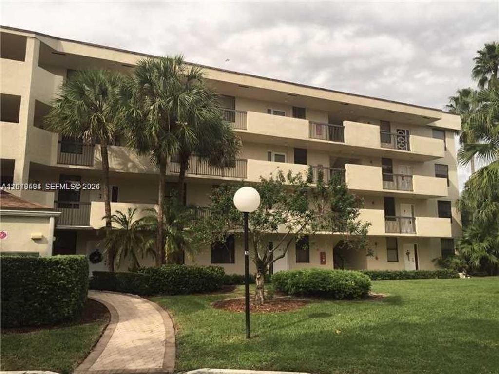 Photo of 3100 NW 42 Ave #D203, Coconut Creek, FL 33066 (MLS # A12010494)