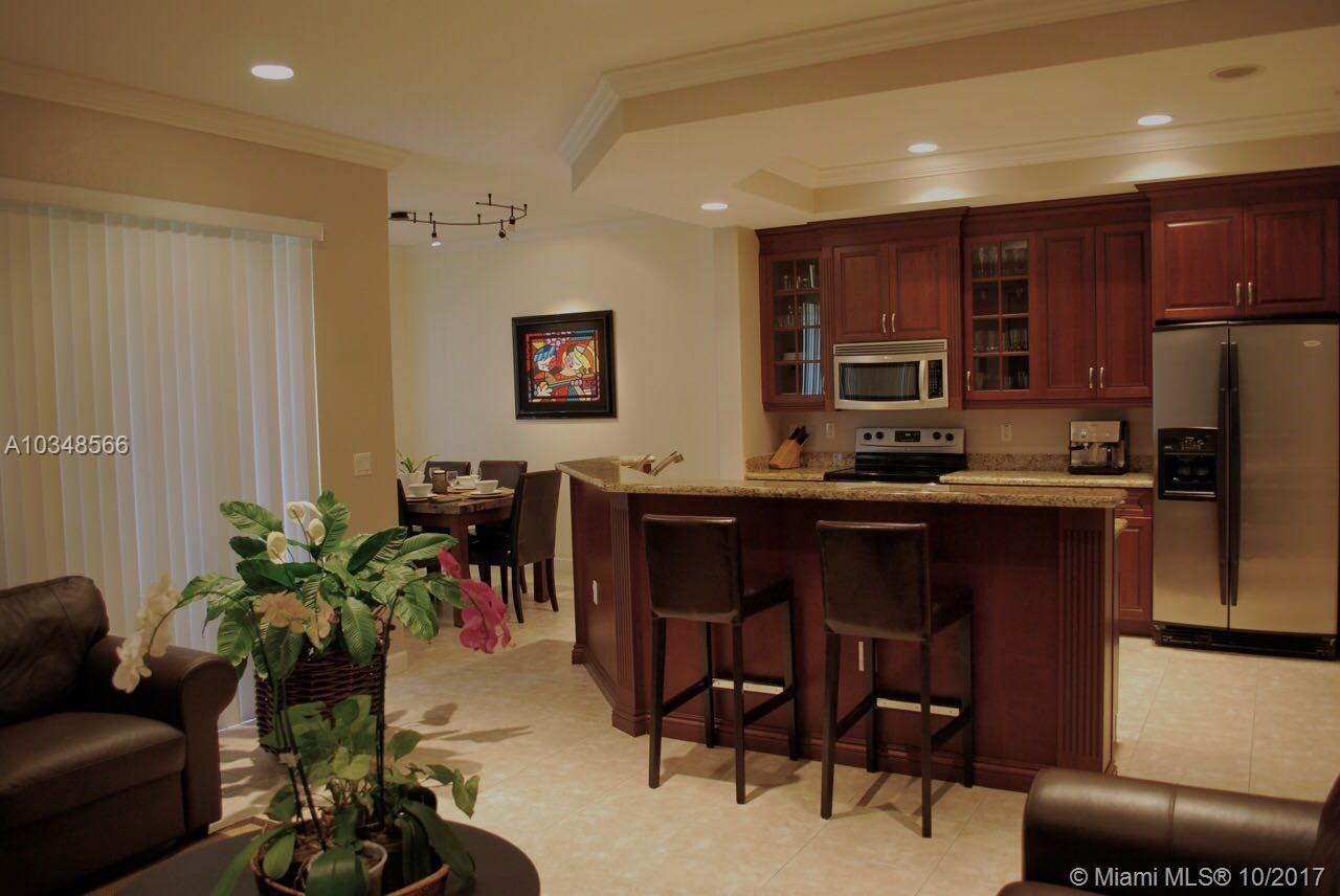 MOVE IN CONDITION,LARGE OPEN KITCHEN, STAINLESS STEEL APPLIANCES,ENGINEERED HARDWOOD FLOORS IN TWO BEDROOMS, TILE IN LIVING AREA, WATCH THE BEAUTIFUL SUNSETS FROM YOUR PATIO, ENJOY ALL THE AMENITIES THAT HERON BAY HAS TO OFFER, TENNIS COURTS, 3 RESORT POOLS, FITNESS CENTER, PLAY AREAS FOR CHILDREN AND MUCH MORE.