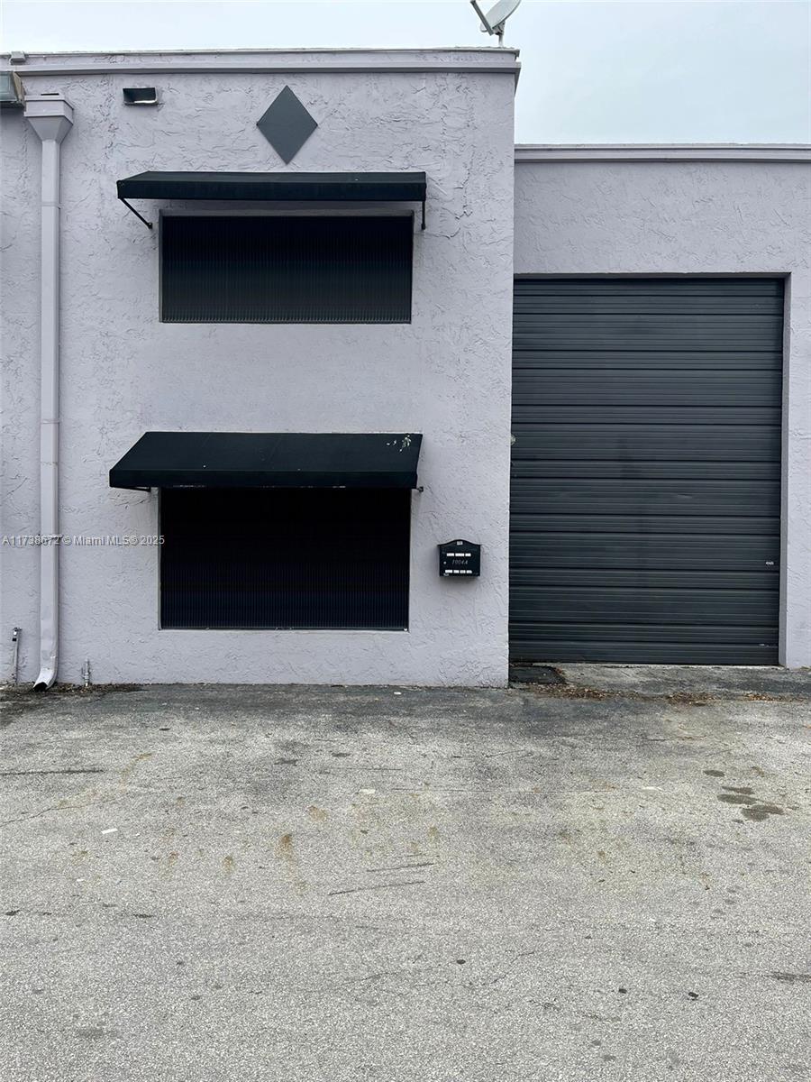 We present to you tis Warehouse with Spacious two story office. 100% central A/C. In the most convenient location, just off of Palmetto Expressway / Okeechobee. FLEX SPACE. First floor is 1166 sq. ft. and the upstairs mezzanine office is about 360 sq. ft. Featuring about 14' high by 10'.2" Wide bay door. The warehouse has a ceilings about 16'.2" height. Downstairs with a kitchen, large bathroom with shower / storage room, server room, and conference room area . The upstairs is very nicely built out, it has a spacious private executive office with wood flooring, and 2 big closets, cabinets .Property has alarm system. Unit is in excellent condition. Good for Paint Shoop, Sign Company, Print Shoop, and Much More. The back of the warehouse is 24'.6" Wide. Front Warehouse 11'.2" Wide.
