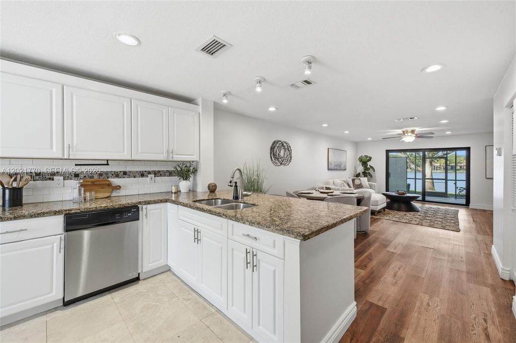 Photo of 1257 NW 98th Ter #154, Pembroke Pines, FL 33024 (MLS # A12021770)