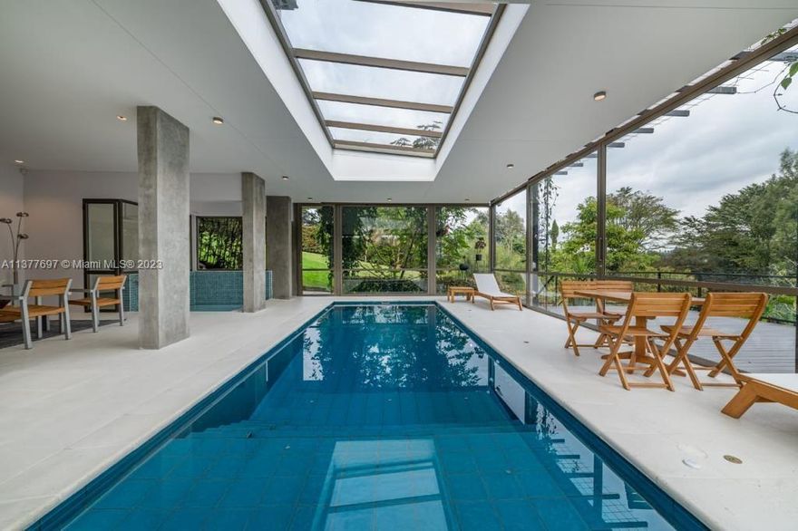 Welcome to this charming, 4 bed, 5 full bath,and 1 half-bath residence located in an exclusive Valle Alto condominium located on Rionegro near Medellin. This is a modern house build in 2008 and completely renovated in 2021. Upon entering, residents will find a bright and modern open floor plan.It features a large living space with chimney and a sitting room with direct entry to a dining room and a gourmet dining table. Each room has his own bathroom and brings the beauty of the outdoors with inside, ensconced by a parade of windows that flaunt the surrounding envy-hued landscape. The basement space offers a beautiful temperature control swimming pool, Jacuzzi play room and access to deck with a beautiful backyard.The house is equipped with electrical panels that support the entire house.