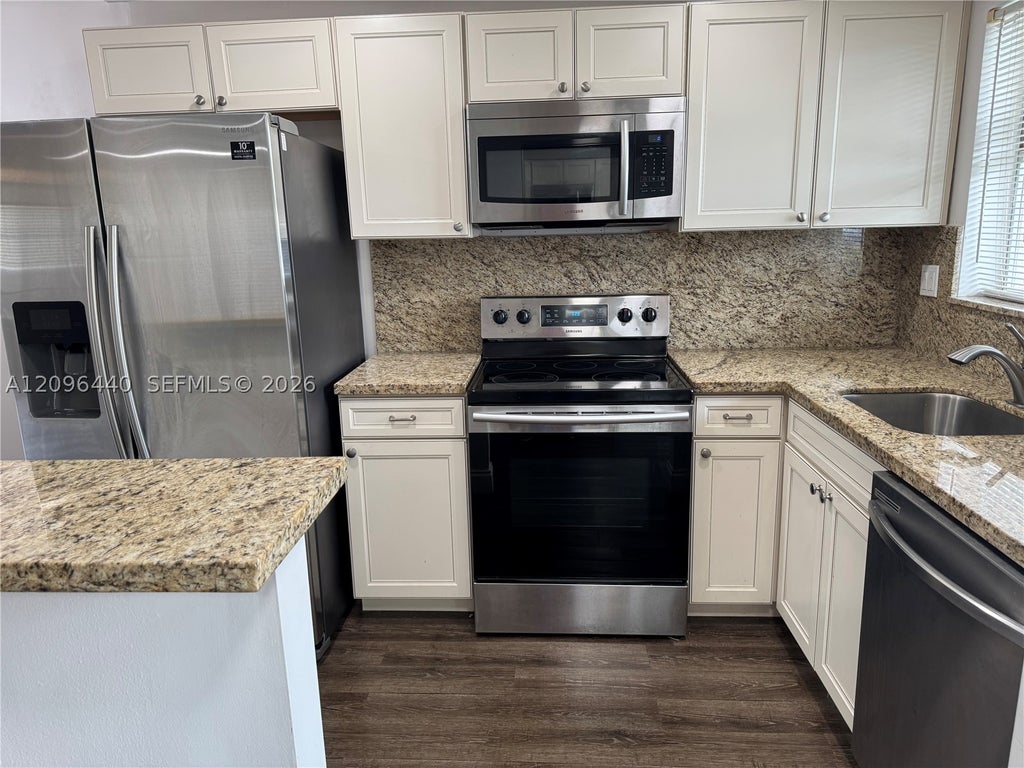 Photo of 8325 Sunrise Lakes Blvd #103, Sunrise, FL 33322 (MLS # A12096440)