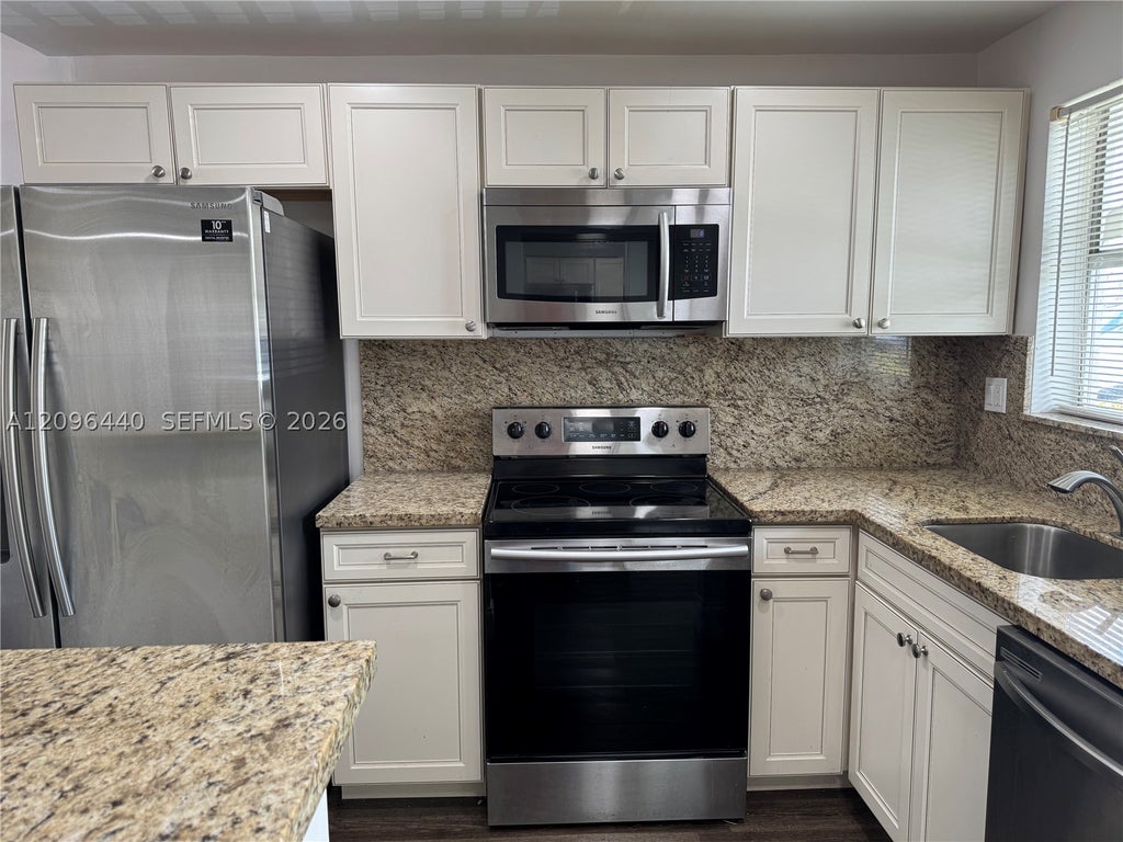 Photo of 8325 Sunrise Lakes Blvd #103, Sunrise, FL 33322 (MLS # A12096440)