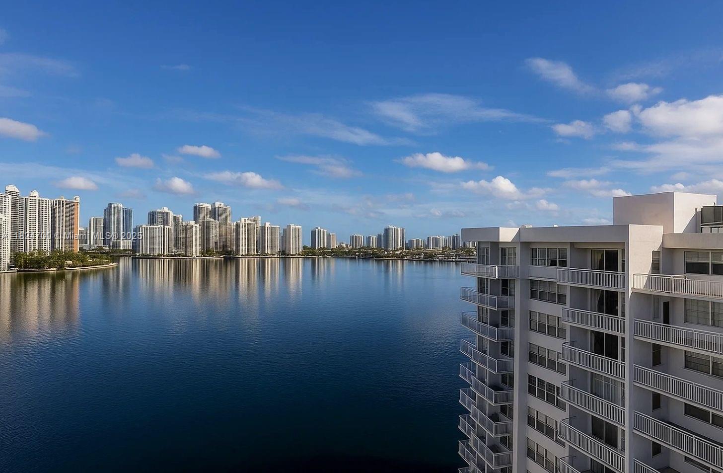 Renovated 2-bed, 2-bath condo with stunning water and city views from the moment you enter. Features include a custom kitchen, modern bathrooms, tile floors, and impact windows/doors. Enjoy a spacious layout with warm contemporary finishes and a balcony perfect for sunrises. Comes with a private storage unit. Resort-style amenities include tennis courts, new pool and deck, gym, marina, and more. Prime Aventura location near Aventura Mall, Publix, top dining, and the Circle walking path.