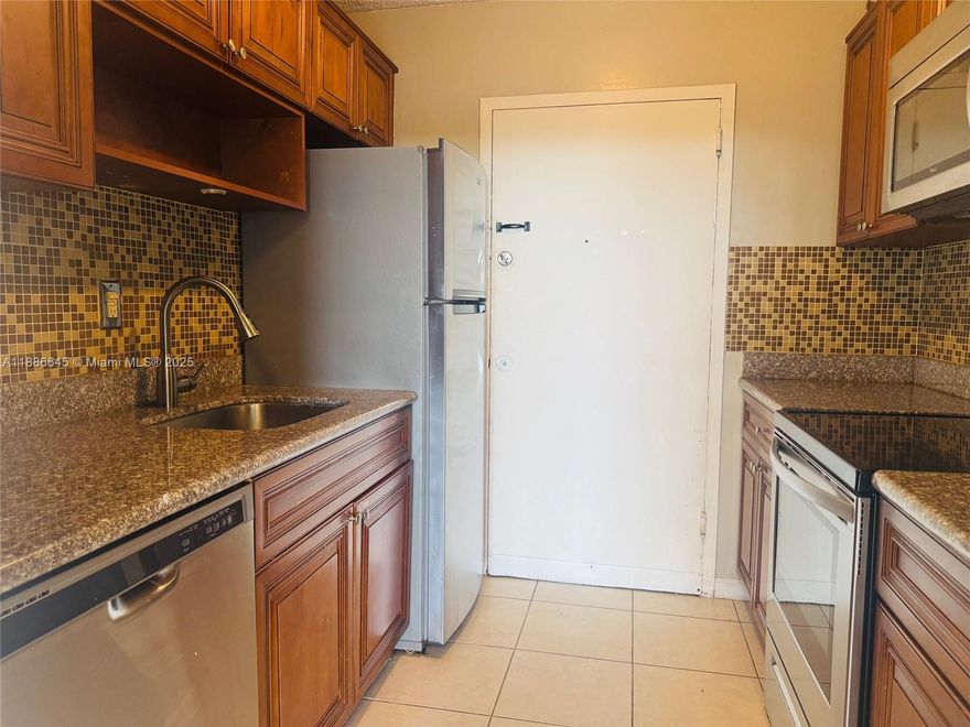 Move in ready 2/2 in nice area of North Miami. Well maintained apartment features kitchen with SS appliances, solid counters and backsplash. Primary bedroom has full wall closet and glass enclosed shower. This open concept unit is fully tiled and has balcony with a street view. Building has pool and gym and is located beside a canal with docking facilities. One assigned parking. Close to park and some stores. Near to Aventura Mall and many other facilities and services.
