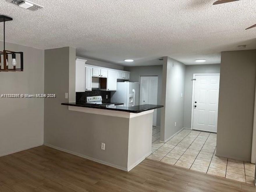 Beautifully remodeled 2-bedroom, 2-bathroom unit with in-unit washer and dryer. Features laminated floors, a remodeled white kitchen, and fresh paint throughout. Located in a well-managed, gated community offering access to two pools, a playground, tennis courts, a gym, a BBQ area, and ample parking (up to six cars/unassigned). Visitors parking up to 14 days. Pet-friendly and centrally located near major highways, dining, and shopping. On-site management office. Immediate rentals allowed. Automatic electric gate. Atlantic Springs is one of the best investment opportunities in Coral Springs, one of the safest cities in the county with a highly rated school district. Move-in ready. No assessments. The only 2-bedroom, 2-bathroom unit currently for sale!