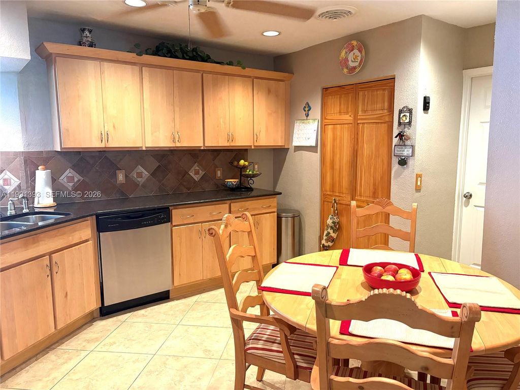 Photo of 4430 NW 6th Ct, Coconut Creek, FL 33066 (MLS # A11991393)