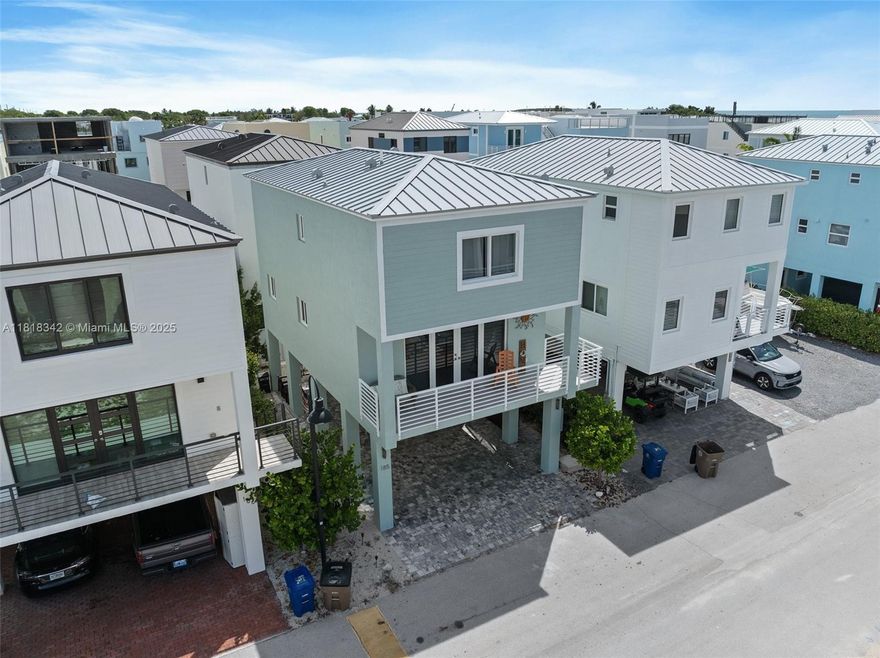 Indulge in coastal luxury at Key Largo Ocean Resort, one of the Florida Keys’ most coveted gated communities. This spacious, high-ceiling residence showcases top-tier craftsmanship and contemporary elegance throughout. The open-concept design is anchored by a gourmet kitchen featuring granite countertops, custom cabinetry, Stainless Steel appliance suite, 33x33 oversized ceramic tile floors, recessed lighting, plus all furniture is included—perfect for entertaining. High-impact windows and doors, and the open balcony provides the perfect spot to unwind. Each generously sized bedroom is beautifully appointed with ample closet space and upscale finishes. Additional highlights include a ground-level storage room/office + a total of three air conditioning units.