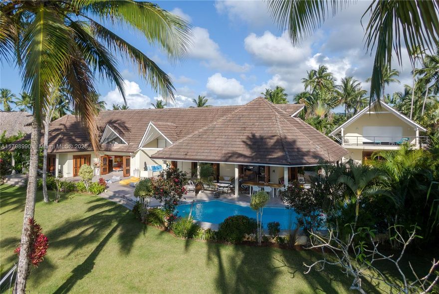 Oceanfront estate in Las Terrenas with 124.7 feet of direct beach frontage. This fully furnished and equipped 9-bedroom, 9-bathroom property includes artwork and decor, offering 7,067 sq ft of interior space, 4,570 sq ft of terraces, and sits on a 51,860 sq ft lot. Includes a 4,306 sq ft guest house and parking area. Built in 2006 and recently renovated. A rare opportunity for luxury living or rental investment in one of the most exclusive areas of the Dominican Republic.