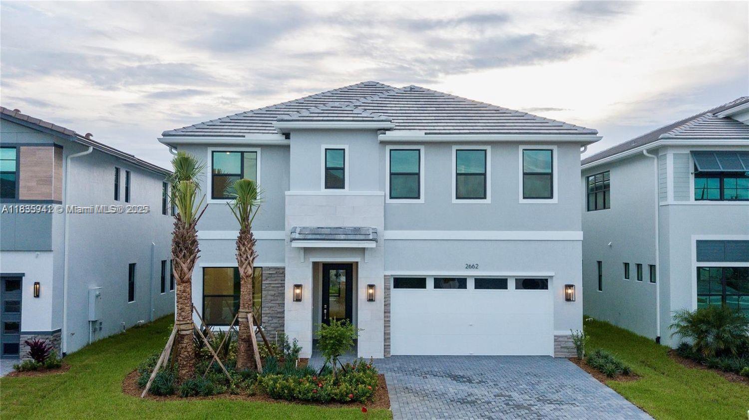 Welcome to Miro, a luxurious two-story home in the exclusive Sienna community of Cooper City. Spanning 4,168 sq. ft., this home features 6 bedrooms and 5.5 bathrooms, offering modern design and comfort. The open-concept layout greets you with soaring ceilings and abundant natural light. The gourmet kitchen includes a large island, quartz countertops, and stainless-steel appliances, perfect for both everyday living and entertaining. The first floor provides two bedrooms, each with an en-suite bath, ideal for guests or multigenerational living. Upstairs, the master suite offers dual walk-in closets and a spacious, spa-like shower. A loft area and a 2-car garage with Level 2 EV charging complete the home. Located minutes from top-rated schools, shopping, dining, and Fort Lauderdale Airport.