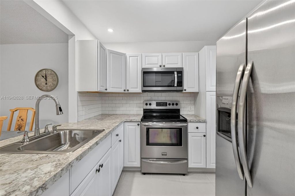 Photo of 5000 NW 36th St #410, Lauderdale Lakes, FL 33319 (MLS # A11942628)