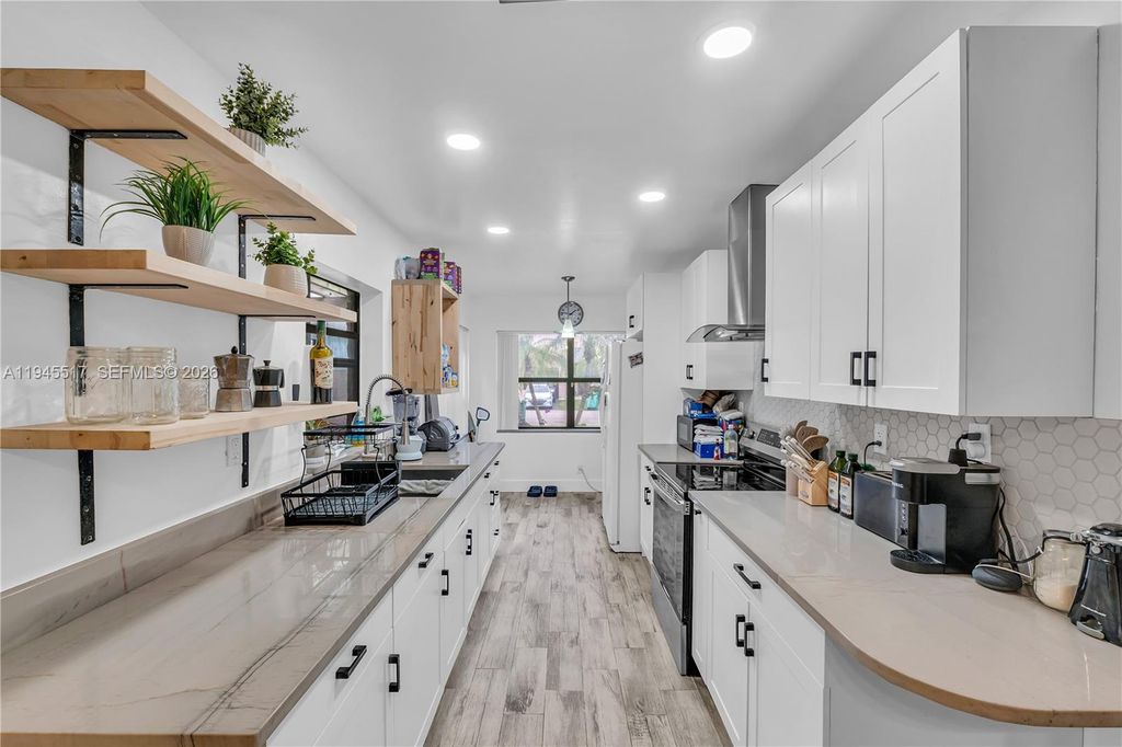 Photo of 8202 NW 100th Dr, Tamarac, FL 33321 (MLS # A11945517)