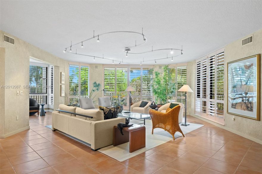 Rare opportunity to own a spacious professionally designed Fairway Point residence inside Boca West Country Club. This 3-bedroom, 3-bath condo offers 3,348 square feet, a desirable split-bedroom layout, and beautiful golf course and water views from a private wrap-around terrace. The home features generous living and entertaining spaces, including a formal dining room, library/den, eat-in kitchen with breakfast bar, and a comfortable primary suite with a large bathroom & shower. The guest suite includes a renovated ensuite bath with a tub/shower combination and a custom-fitted walk-in closet. Additional features include Sub-Zero and Miele appliances, full impact windows and doors, excellent closet space, and a covered parking space just STEPS from the lobby. 
Fairway Point offers easy, full-service living with an attended lobby, secure building access, and friendly staff. Boca West is one of Boca Raton’s premier private residential country club communities, offering an exceptional lifestyle across approximately 1,400 acres with four championship golf courses, tennis, pickleball, aquatics, spa, fitness center, dining, lounges, card rooms, and endless social activities. Mandatory membership required. Current initiation fee is $150,000, plus a $10,000 capital contribution and required annual social dues of $24,454.85. Initiation fee is about to increase by $65,000. Purchase now to lock in today's price.