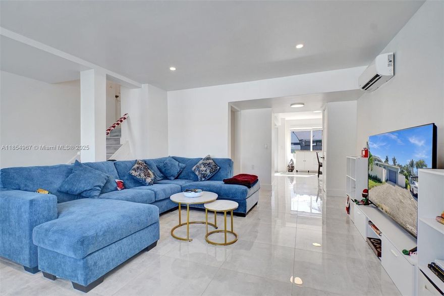 This updated 3-bedroom, 2-bathroom home features elegant marble and tile flooring and comes fully furnished for immediate move-in. The open-concept layout offers a clean, modern aesthetic with ample natural light. On a spacious corner lot, the property includes a private 2BR/1BA guest suite with separate utilities—ideal for extended family or rental income.