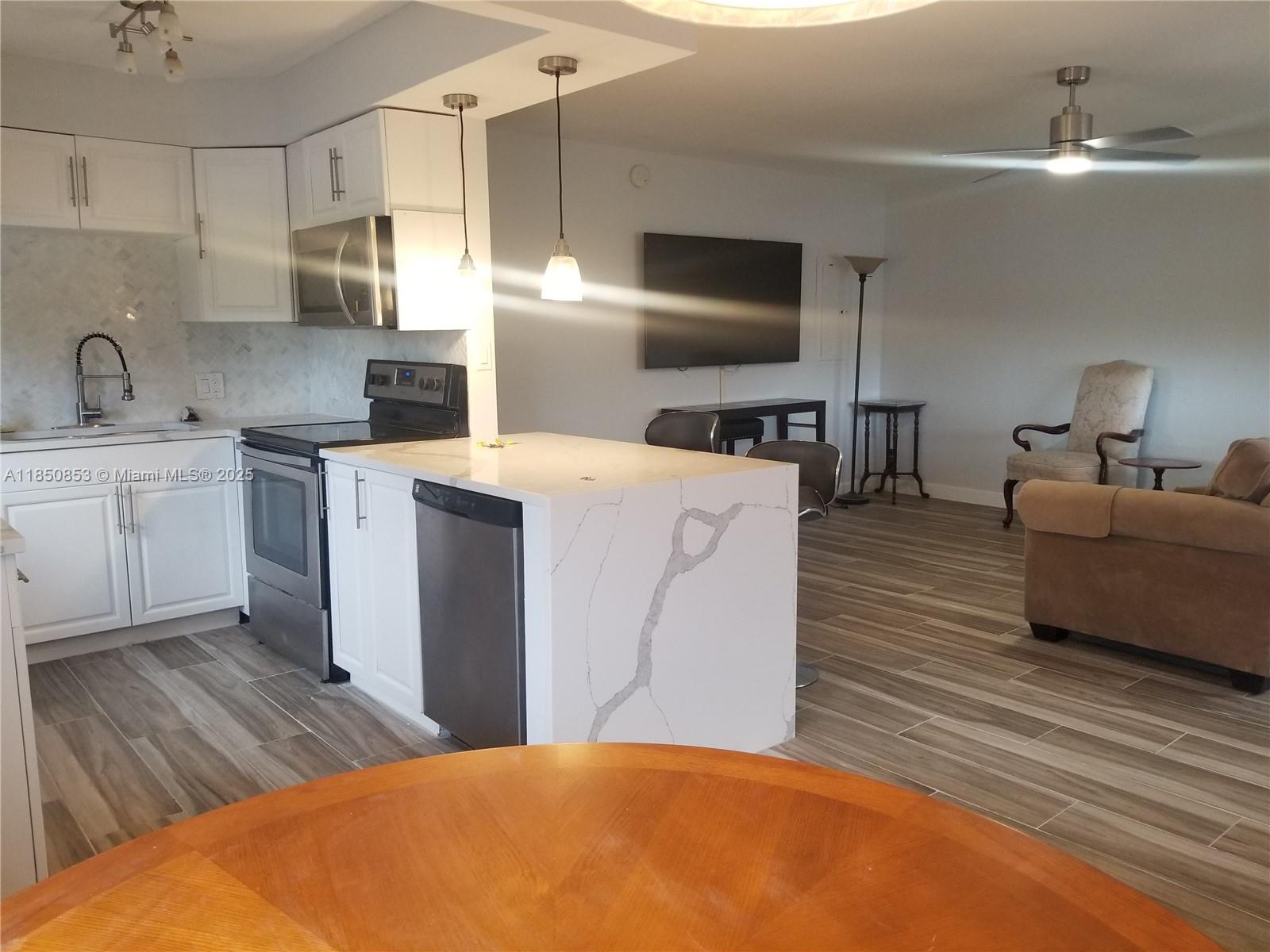 Stunning, light-filled, and fully upgraded unit featuring wood look tile floor for easy maintenace, modern cabinets and appliances, elegant quartz countertops. Amazing Lake view. Parking spot a few steps from your door. Move-in ready. Rent includes basic cable. Washer and Dryer inside the unit. 55+ active community with a sparkling swimming pool and 3 million renovated Club House. Don’t miss the chance to make this beautiful home yours—schedule a visit today!