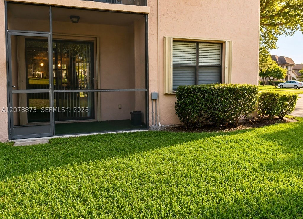 Photo of 10325 NW 11th St #101, Pembroke Pines, FL 33026 (MLS # A12078873)