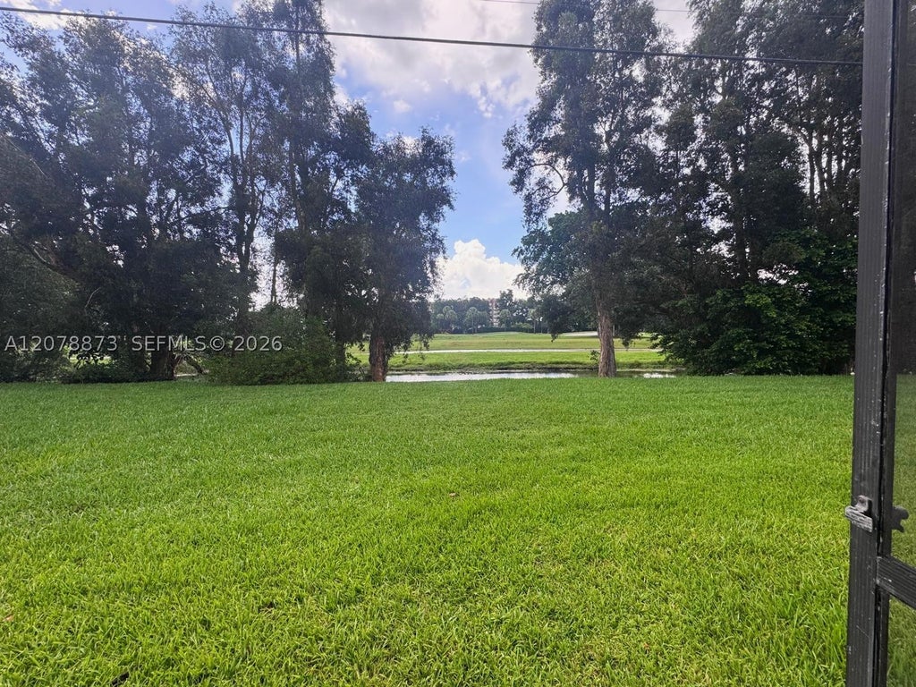 Photo of 10325 NW 11th St #101, Pembroke Pines, FL 33026 (MLS # A12078873)