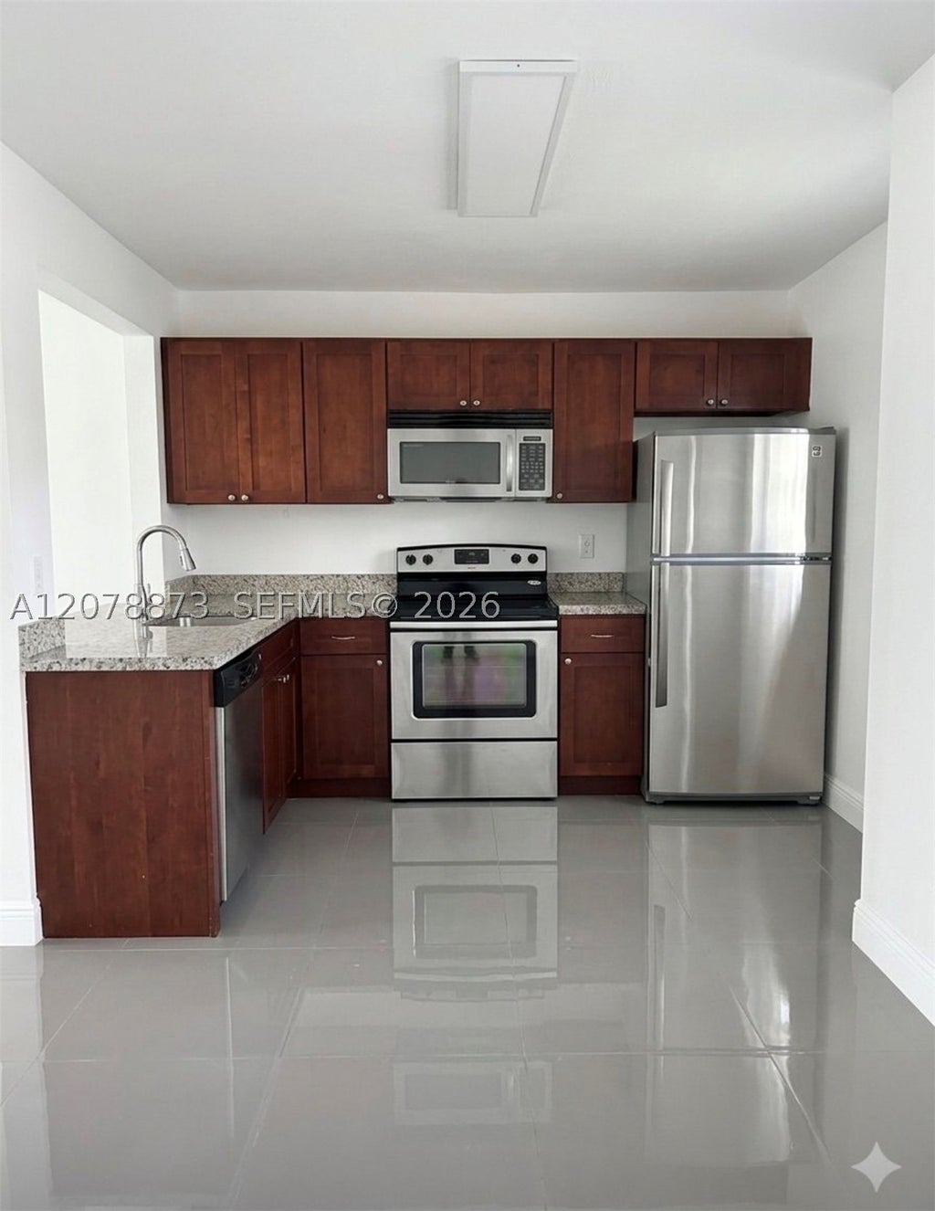 Photo of 10325 NW 11th St #101, Pembroke Pines, FL 33026 (MLS # A12078873)