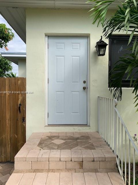 Large One Bedroom, One Bath Home with hurricane impact windows, private fenced in yard and screened in back porch. House is located behind main house (4801) with entrance to the back through walkway located next to main house. One assigned parking space located on driveway. Large laundry room with ample storage. Bedroom is large enough for a king sized bed. Walk-in closet with cabinetry. Bathroom has large walk in shower. Pets allowed, but no aggressive breeds will be permitted, only 1 large dog, or 2 small pets. Located 3 miles to Miami Airport and Coral Gables. Utilities not included in rent. Lawn maintenance is included. Only 2 occupants will be permitted. All offers must be accompanied with credit and background check reports.