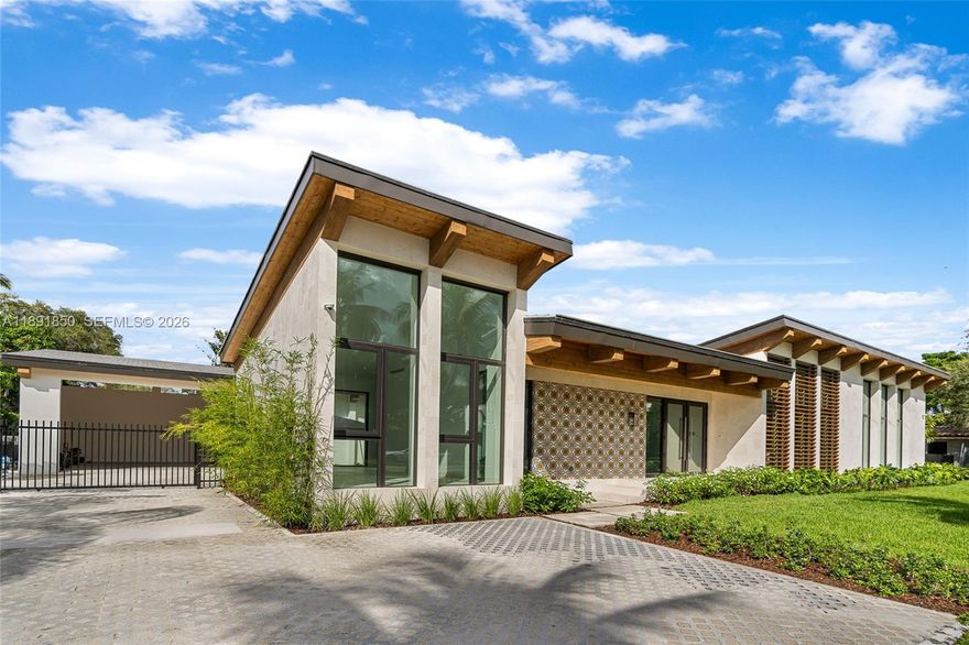 Introducing 6716 San Vicente Street, a Mediterranean modern residence in Coral Gables. Set on a 15,750 sq ft oversized lot, the home offers 5,077 sq ft of living area with 6 bedrooms and 6 bathrooms. Designed around a series of courtyards, the layout emphasizes seamless indoor–outdoor living with a landscaped atrium and a 35’ x 15’ pool with spa. Distinctive features include high ceilings, expansive glass walls, coral rock accents, and refined wood details. Ideally situated east of US-1 near Riviera Drive and the Gables Waterway, the property offers privacy, covered parking, and landscaped gardens.