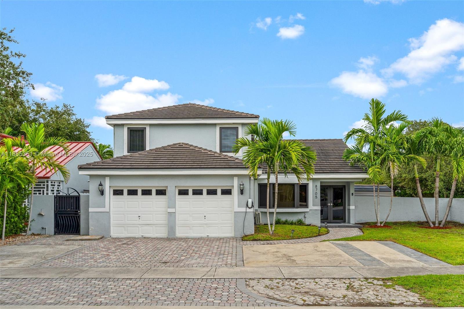 Located in one of the most desirable and peaceful neighborhoods of Miami Lakes, with NO HOA this beautifully maintained corner property offers 4 bedrooms and 2.5 bathrooms, with the primary suite conveniently situated on the first floor. The home features fully remodeled bathrooms, impact-resistant windows, an alarm system, a spacious kitchen with dining area, a brand-new roof, and a new A/C system. Enjoy a covered patio perfect for outdoor gatherings and family living. The garage has been converted into a private 1-bedroom apartment, ideal for guests or additional income. Surrounded by excellent neighbors, this home is just minutes from top-rated schools and shopping centers, making it an exceptional opportunity that combines comfort, security, and investment value.