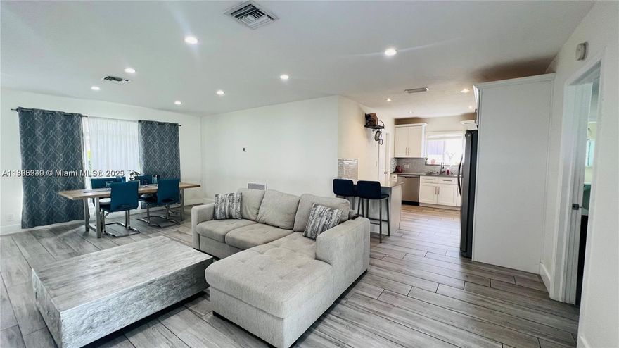 Beach & Boardwalk (5’), Dania Pointe (12’), and Aventura Mall (18’). Enjoy an open, bright floor plan with sleek gray tile flooring, quartz counters, stainless steel appliances, and water filtration system. Spacious laundry room and generous closets. Step outside to a private outdoor oasis—large fenced yard (6,000+ SF) ideal for entertaining or relaxing. Tesla charger included. Easy access to highways, parks, and shopping. A true turn-key gem in one of South Florida’s most desirable neighborhoods!