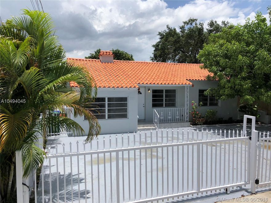 Centrally located 2/1 spacious property welcomes you in full of light, tiled throughout out and working fireplace give it the extra charm. Home has a living, dining and Florida room and a converted garage adds an additional room. Recently updated granite kitchen counter and bathroom. Nice size yard with a built-in bar is setup for entertainment. close to downtown Miami. schools, shopping and parks, house complete gated for your security.....  PROPERTY WAS UNDER CONTRACT BEFORE FOR $342,000 AND APPRAISED WITH NO PROBLEMS,IF YOUR CLIENT IS APPROVED BY FHA THERE IS NO NEED EXPEND MONEY ON  ANOTHER APPRAISSAL..... PROPERTY HAS AN FHA CASE OPEN ALREADY...EASY TO CLOSE..