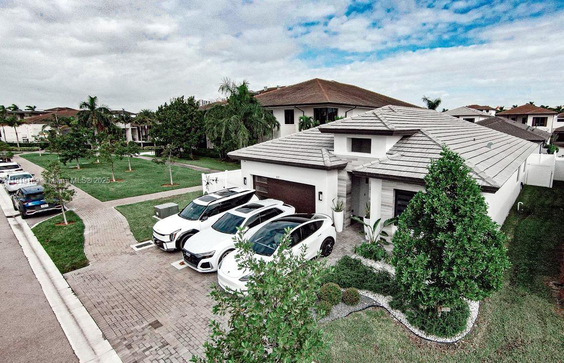 FOR SALE – SINGLE FAMILY HOME IN DOWNTOWN DORAL
Spacious 2,285 sq ft residence on a premium 5,842.5 sq ft lot, plus 1,332.5 sq ft of additional land compared to most homes in the area. Parking for up to 5 vehicles, including 2 covered spaces, 3 uncovered, and an extra driveway. Corner lot next to the clubhouse with a fully fenced yard offering privacy and security.
Built in 2022 and first occupied in July 2023. Garage features custom closets and epoxy flooring. Hurricane- and impact-resistant windows. Exterior security camera system. Custom closets in all bedrooms. Modern kitchen with KitchenAid appliances. Side garage access to backyard. Includes interior design by Andrea Anez Interiors. HOA fee $348/month with clubhouse and gym access.