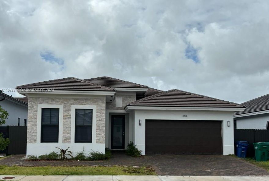 BEAUTIFUL NEW CONSTRUCTION MULTIGENERATION HOME. 4 Bedrooms and 3 Bath. In Law Suite with separate A/C and private entrance, kitchen,stainless steel refrigerator, Sink, washer and dryer include. Spacious master room and walk-in closets. Style Modern integrated. Big back yard ideal for pool construction. !NO ASSOCIATION!: No Fees, no Rules... VERY QUIET COMMUNITY. FAST ACCESS TO 8 ST. AND 26 ST. (CORAL WAY) To close to shopping center, publix, fresco. Baptist  Emergency Care very close.