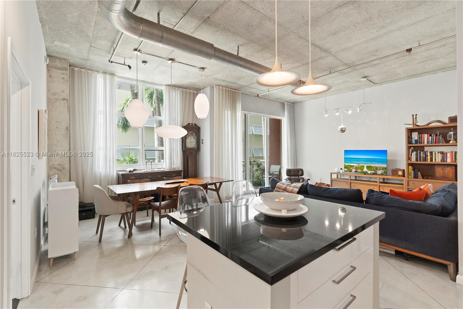 This stunning and very spacious one bedroom condo + large den at the sought after Cité on the Bay is a must see! Located in Edgewater and across from Margaret Pace Park, Cité on the Bay is a full service condo with great amenities. Unit #2201 is on the loft side offering 11' ceilings, polished concrete floors, a remodeled kitchen & beautifully renovated bathroom, an enclosed den the size of a bedroom & a balcony facing the tranquil courtyard. Floor to ceiling glass makes this home very bright all day long and the exposed concrete ceiling and columns adds to the modern loft style look. Cité offers a complete fitness center with high end equipment, a resort style pool, valet, 24hr front desk lobby attendant & concierge plus much more. Close to M. Beach, Design District and Midtown Shopping!