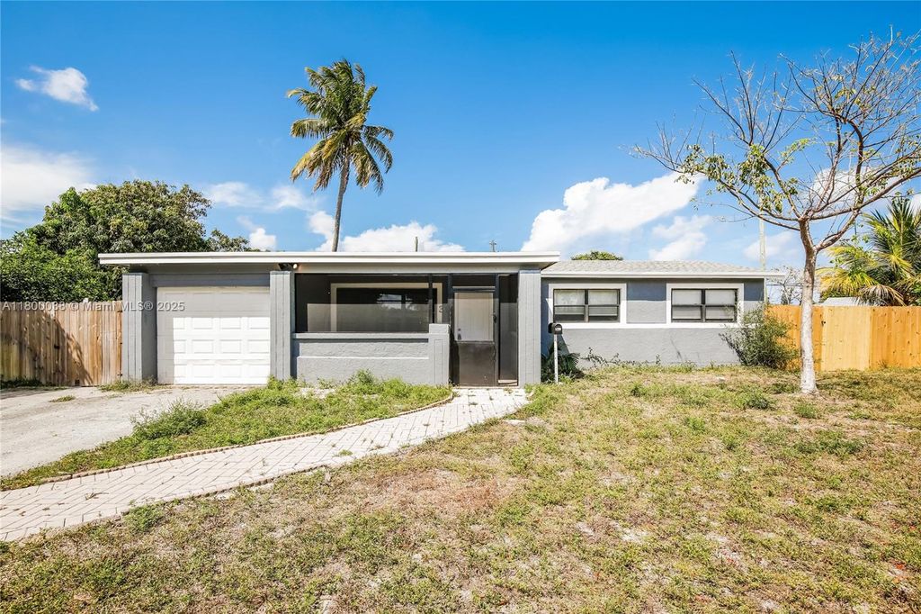 Photo of 311 NW 42nd St, Deerfield Beach, FL 33064 (MLS # A11800038)