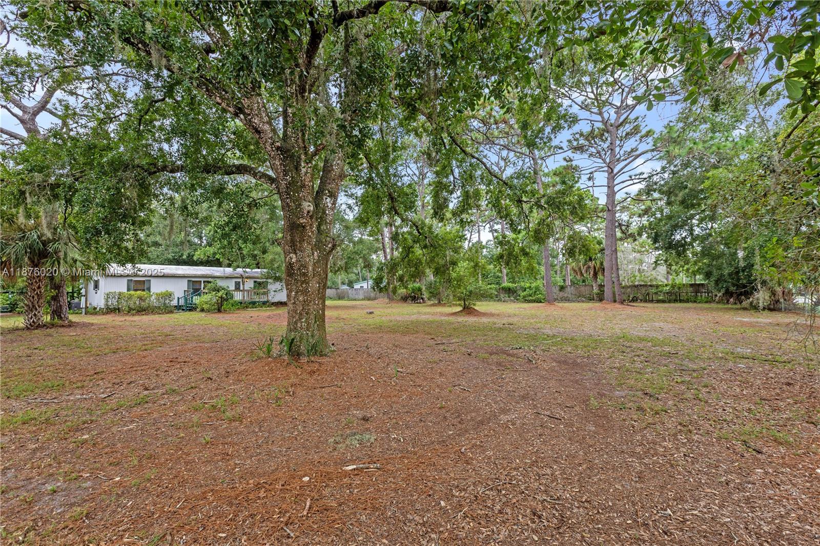 Manufactured home on 1-acre lot in tranquil, wooded Lutz, FL. Built in 1986, featuring 3 bedrooms, 2 full baths, and 1,248 sq ft. Private setting in a quiet rural-suburban neighborhood with conservation lots and mature trees. Many neighboring properties have been torn down and rebuilt with custom homes, offering strong potential for redevelopment. Lutz is regarded as a desirable community with excellent schools, parks, and low crime, while still being convenient to dining, shopping, and only 15 miles from Tampa.