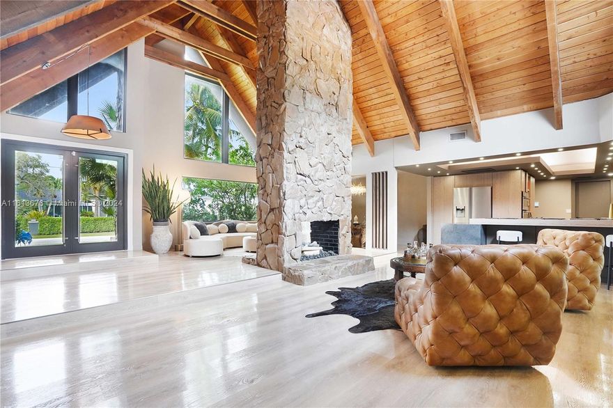 Over 4000 SqFt on .81 acre. Completely redesigned by Italian designer. A true, private one of a kind oasis tucked away in a cul-de-sac, in prestigious Plantation Acres. Close to American Heritage School (ranked #1 private school in the US). Sprawling home featuring a completely redesigned kitchen, wood beam ceilings, impact windows throughout. In-law, au-pair or teenage quarters, with spacious bedroom, living room and full bath with a separate entrance! Pool recently updated. The lushly landscaped pool area provides privacy, raised spa, waterfall and a jacuzzi. Two separate garages (4 cars), ample parking in the driveway and a slab for a boat or additional parking. Close to Sawgrass Mills and Plantation Acres Equestrian Center. Retiring to Europe. Completely furnished if desired.