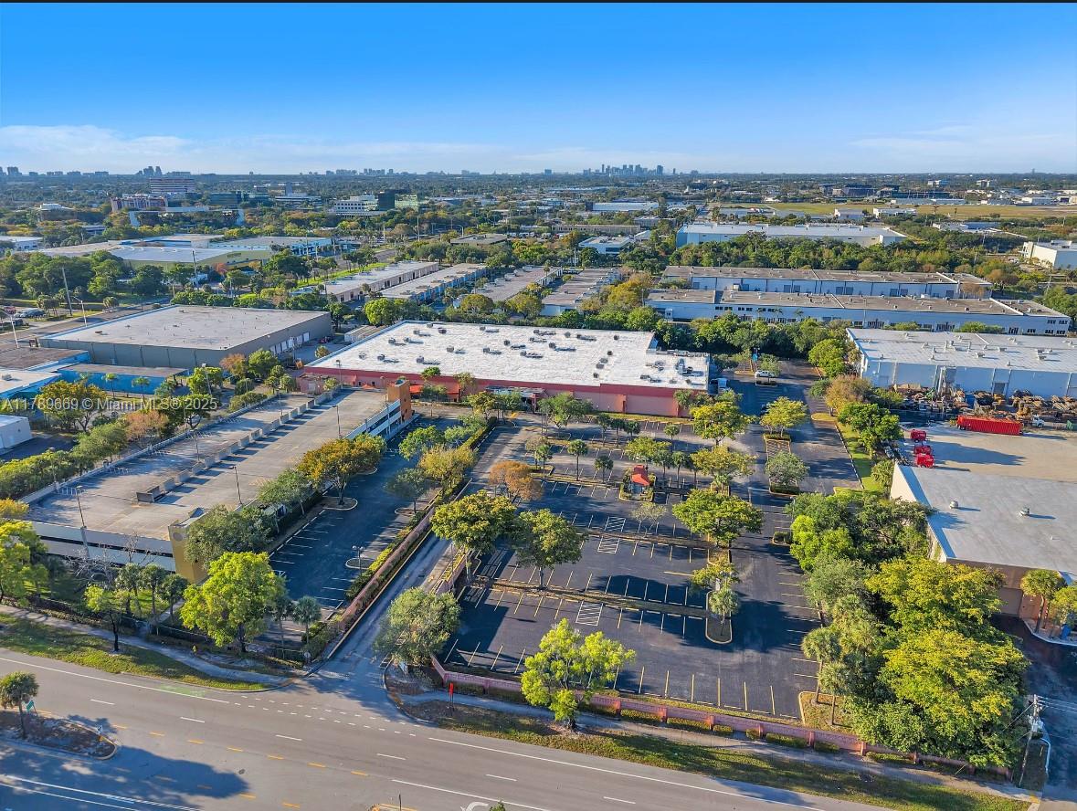 1100 W McNab encompasses 82,584 of Gross Leaseble Area on 6.85 acres along McNab Road, just west of Powerline Road, within Pompano Beach’s Gateway Industrial area. Originally constructed as a warehouse in 1971, the property underwent significant renovations in 2015, coinciding with a lease agreement with ChildNet. The upgrades, totaling over $1.5 million, included the installation of impact-resistant glass windows, roof sealing, both interior and exterior improvements, access control systems, security cameras, & customized enhancements for the tenant. In addition to the main office building, the property includes a three-story parking garage with 237 spaces, increasing the total parking capacity to 525—providing an impressive ratio of more than six spaces per 1,000 square feet.