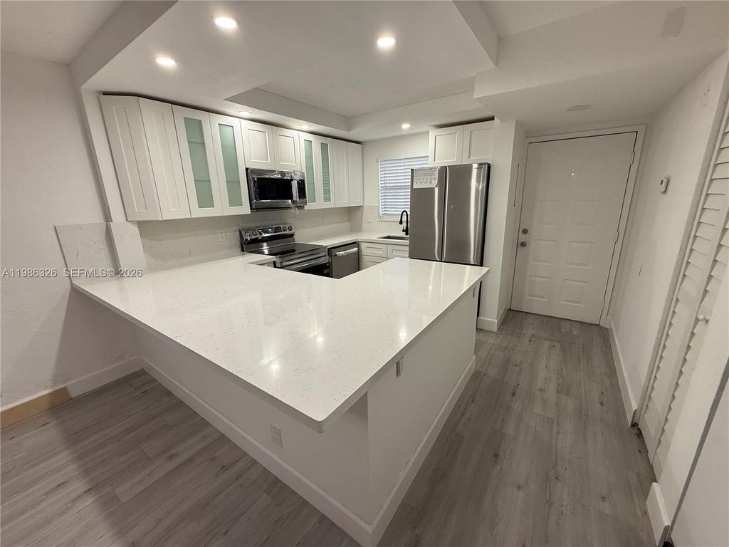 Photo of 11477 NW 39th Ct #104-1, Coral Springs, FL 33065 (MLS # A11986326)