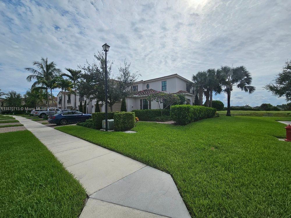 Professionally furnished 3 bedroom with master bedroom on first floor. Separate office with built-ins. This is the largest and most luxurious model home of the community. This corner unit sits on a large waterfront corner lot. Very light and bright open floor plan, 3 1/2 bathrooms, attached 2 car garage and separate laundry room. Large kitchen with double ovens and quartz counter tops and all high end appliances. Open dining and living room overlook the canal and golf course. First floor master suite over looks water with total privacy. Two large walk-in closets and a gorgeous in-suite spa bathroom. Upstairs is a spacious loft ideal for use as the family room or a playroom. Two large bedrooms upstairs with walk-in closets and two full baths. Gated community.