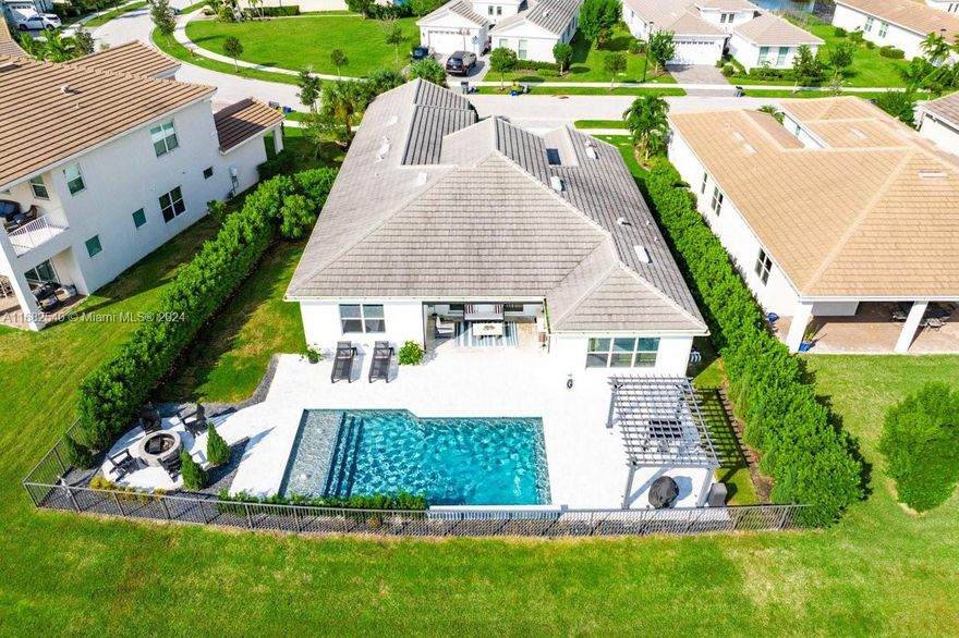 Stunning lakefront home with resort-style amenities!

This lake view retreat offers luxury living on a 1/4 acre. Enjoy a saltwater pool w/ LED lighting, sunshelf, waterfalls &  heated system for year-round fun. Relax by the custom fire pit, in the lanai with a motorized screen, or under the pergola - this home offers outdoor living at it's best. The lush landscaping has a smart sprinkler system & Clusia hedges for privacy. 

The 3-car garage smart garage includes a 240V plug for EVs & lots of space for cars & a golf cart. Inside, the generous layout, modern design and updated appliances offer a turnkey estate home perfect for your family. Enclosed den may be used as 4th bedroom.

Community:
Westlake Adventure Park has basketball, pools, slides, a splash pad, playgrounds, and more.