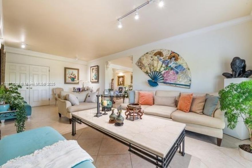 EXCELLENT LOCATION! Bright and spacious 2,750 square foot unit with impact doors and windows and four East-facing balconies has two master suites at opposite ends, plus a 3rd bedroom. Each master has walk-in closets and balcony. One master has two bathrooms. Unit was planned as two and joined together during construction. Secured building has party room with expansive outdoor terraces, gym and pool. Walking distance to free CG Trolley stop, Target and Publix; Miracle Mile is 10 blocks south. Two assigned parking spaces in secured garage. Low HOA fee! Offered partially furnished. Selling AS-IS. Easy to show!