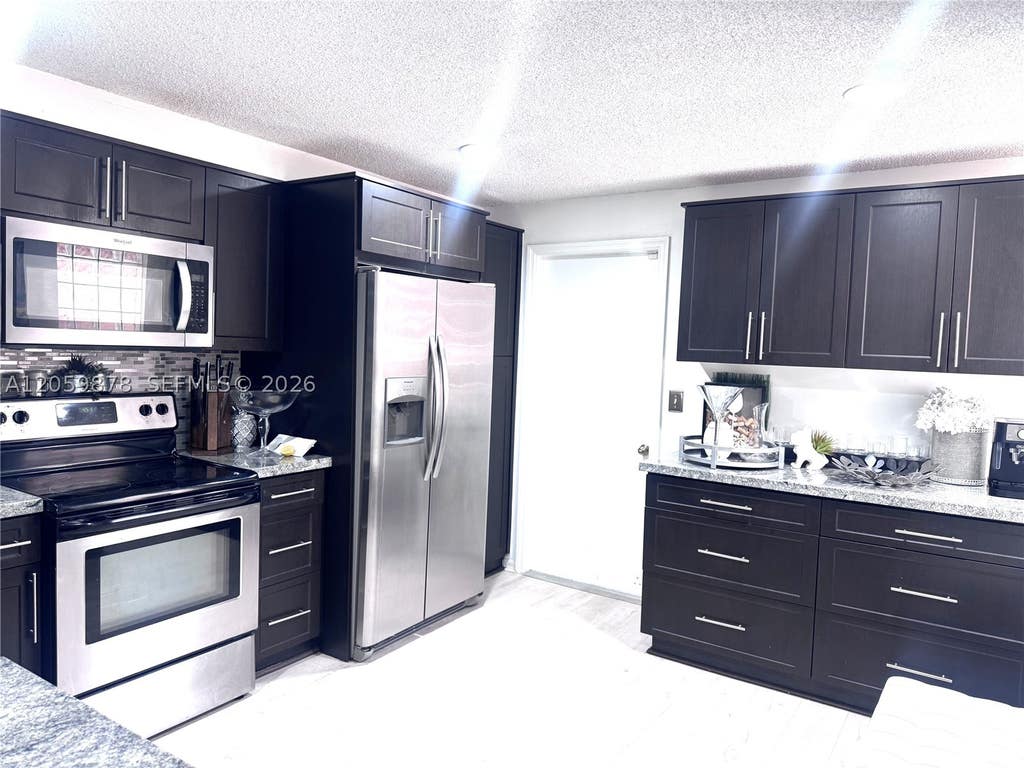 Photo of 1543 Barcelona Way #5-30, Weston, FL 33327 (MLS # A12059878)