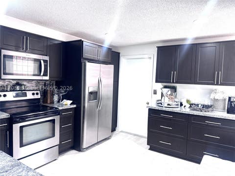 Photo of 1543 Barcelona Way #5-30, Weston, FL 33327 (MLS # A12059878)
