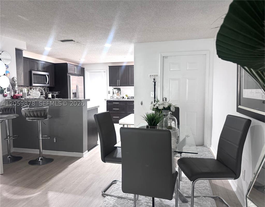 Photo of 1543 Barcelona Way #5-30, Weston, FL 33327 (MLS # A12059878)