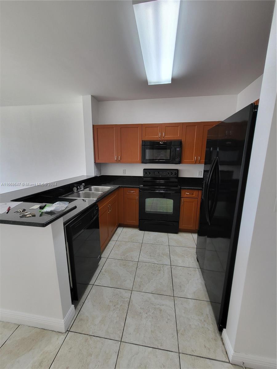 Excellent Location, spacious unit with open kitchen, granite counter tops, great for entertaining, enjoy beautiful sunsets, covered parking, pool, gym and two rec rooms