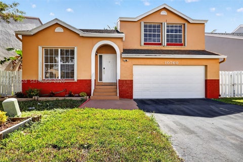 Photo of 10760 SW 11th Dr, Davie, FL 33324 (MLS # A12106228)