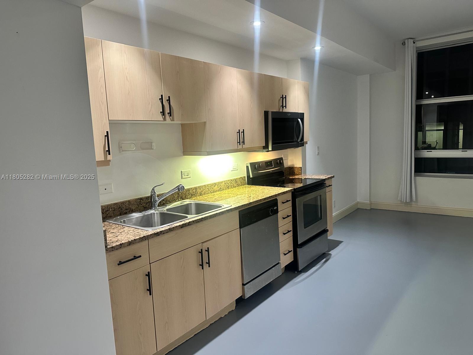 111 E Flagler 702