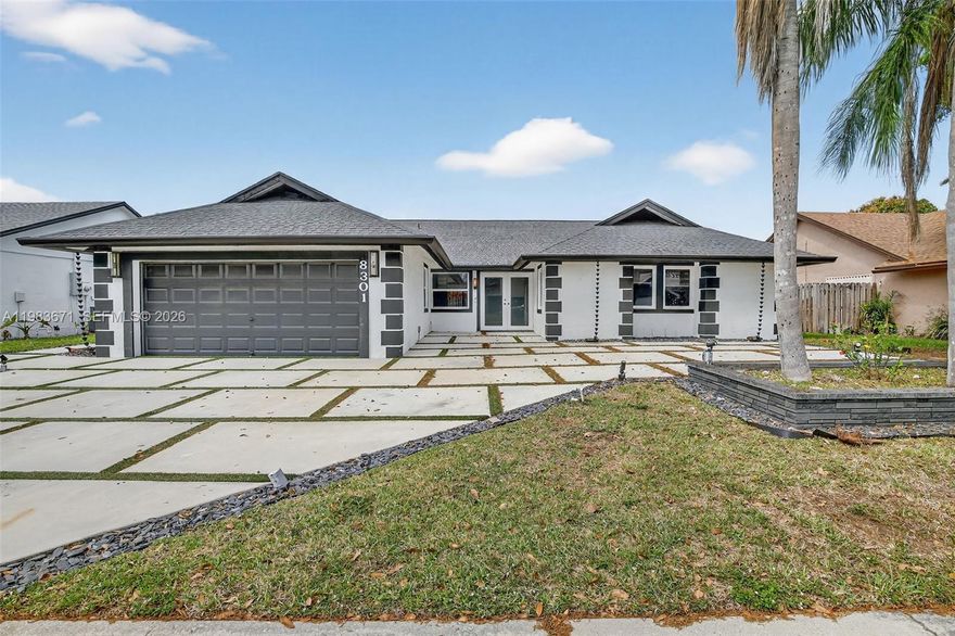 Beautiful, turnkey 3-bedroom, 2-bath home loaded with updates in a non-HOA neighborhood. Upon entering, you’re welcomed by vaulted ceilings, an open floor plan, and abundant natural light streaming through impact windows and doors. The home features tile flooring throughout, a spacious open-concept layout, and a beautifully updated kitchen with stainless steel appliances. The primary suite offers a large walk-in closet, an ensuite bath with double vanities, and sliding glass doors that open to the patio. The fully fenced backyard is designed for enjoyment, with a covered patio, pavered entertaining area, and plenty of space to relax outdoors. Additional features include a 2-car garage with vinyl flooring, and a whole-house water filtration system. The driveway accommodates up to 6 vehicles and has been upgraded with fully permitted pavers and turf. Don't miss this one!