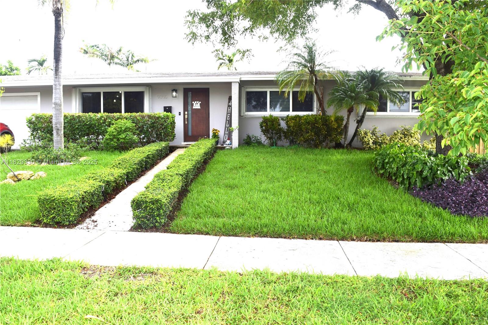Uniquely upgraded 3/2 home with 2 car garage in Palmetto Bay. The many updates include a new kitchen with extra large peninsula, new wood look tile flooring throughout the house, impact windows and doors with accordion shutters, new bathroom with LED light mirror, updated custom closets, and zebra blinds. The home boasts an extra large yard 10,500 square feet, lush landscaping, new shed and garden. A 288 square foot screened patio is perfect for outdoor family living, including meals and fun family time. The 486 sq. ft., 2-car garage has plenty of storage space. "A" rated public schools: Perrine Elementary, Southwood Middle, and Miami Palmetto High. Walking distance to Palmetto Park with a walking trail and multiple team sports. Ample restaurants and amenities nearby.